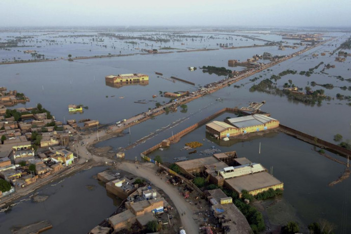 FILE - Homes are surrounded by floodwaters in Sohbat Pur city, a district of Pakistan's southwestern Baluchistan province, Aug. 29, 2022. AP/RSS Photo