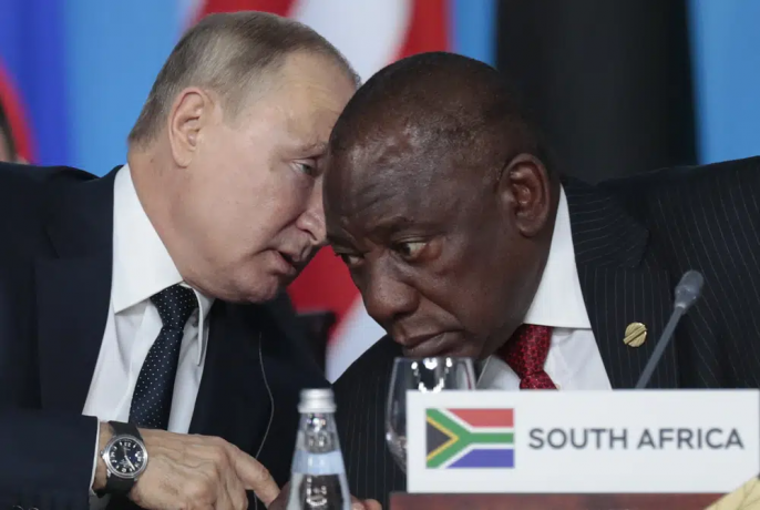 Russian President Vladimir Putin, left, speaks to South African President, Cyril Ramaphosa, during a plenary session at the Russia-Africa summit in the Black Sea resort of Sochi, Russia on Oct. 24, 2019. AP/RSS Photo
