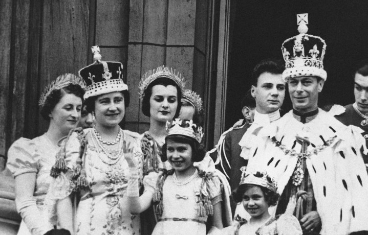 FILE - Princess Elizabeth, center, age 11, appears on the balcony of Buckingham Palace after the coronation of her father, King George VI, right, in London, May 12, 1937. (AP/RSS Photo)