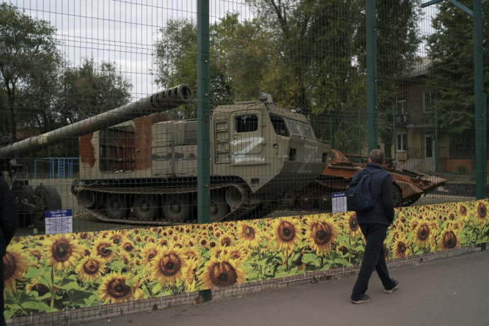 A man walks past a display of destroyed Russian military vehicles during the Defender of Ukraine Day in Kryvyi Rih, Ukraine, Friday, Oct 14, 2022. (AP/RSS Photo)