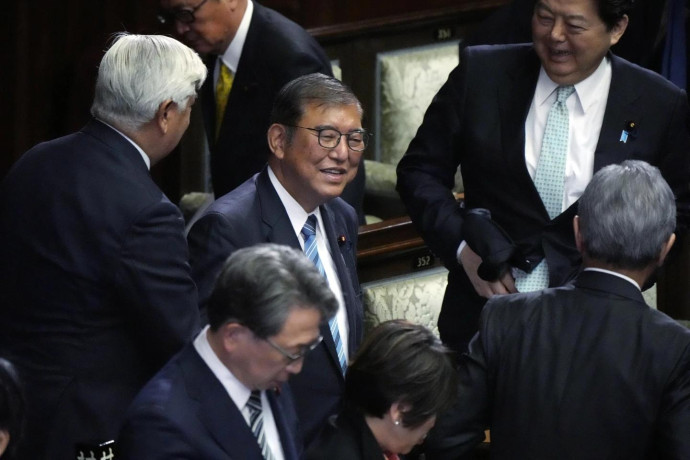 Japanese Prime Minister Shigeru Ishiba, center, reacts as he was elected for a new prime minister at a special parliamentary session of the lower house Monday, Nov. 11, 2024, in Tokyo. (AP Photo)