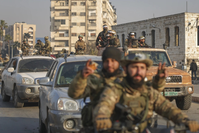 Syrian opposition fighters ride along the streets in the aftermath of the opposition’s takeover of Hama, Syria, Friday, Dec. 6, 2024. AP/RSS Photo