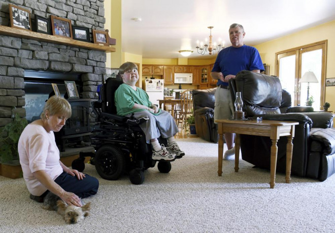 This undated photo shows Terry Horgan with his parents in the family's Montour Falls, New York, home. AP/RSS Photo