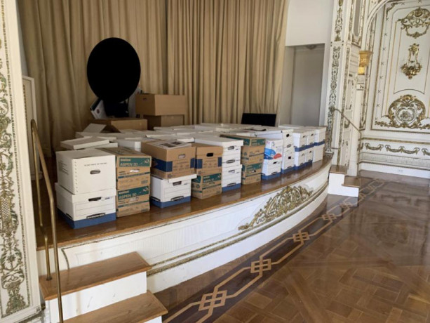 This image, contained in the indictment against former President Donald Trump, shows boxes of records being stored on the stage in the White and Gold Ballroom at Trump's Mar-a-Lago estate in Palm Beach, Florida. AP/RSS Photo