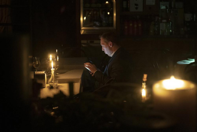A man sits in a caffe during a blackout in Kyiv, Ukraine, Friday, Nov 4, 2022. (AP/RSS Photo)