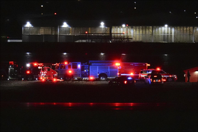 First responders are seen at Ronald Reagan Washington National Airport, Wednesday, Jan. 29, 2025, in Arlington, Va. (AP Photo)