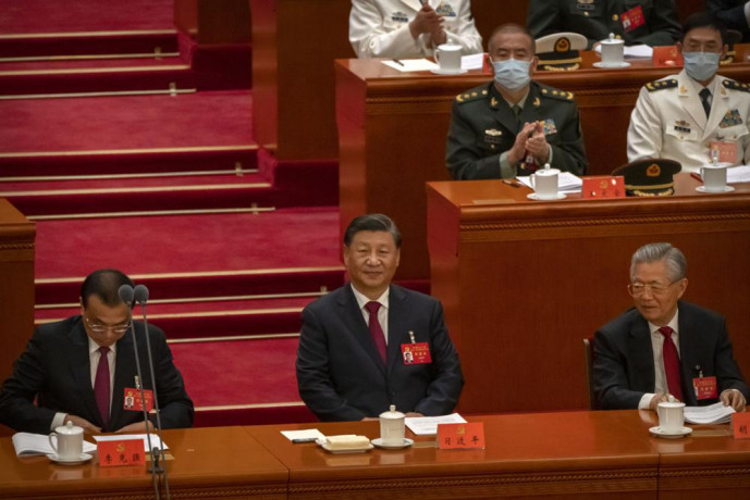 China's President Xi Jinping, center, sits after giving a speech during the opening ceremony of the 20th National Congress of China's ruling Communist Party in Beijing, Sunday, Oct. 16, 2022.  AP/RSS Photo