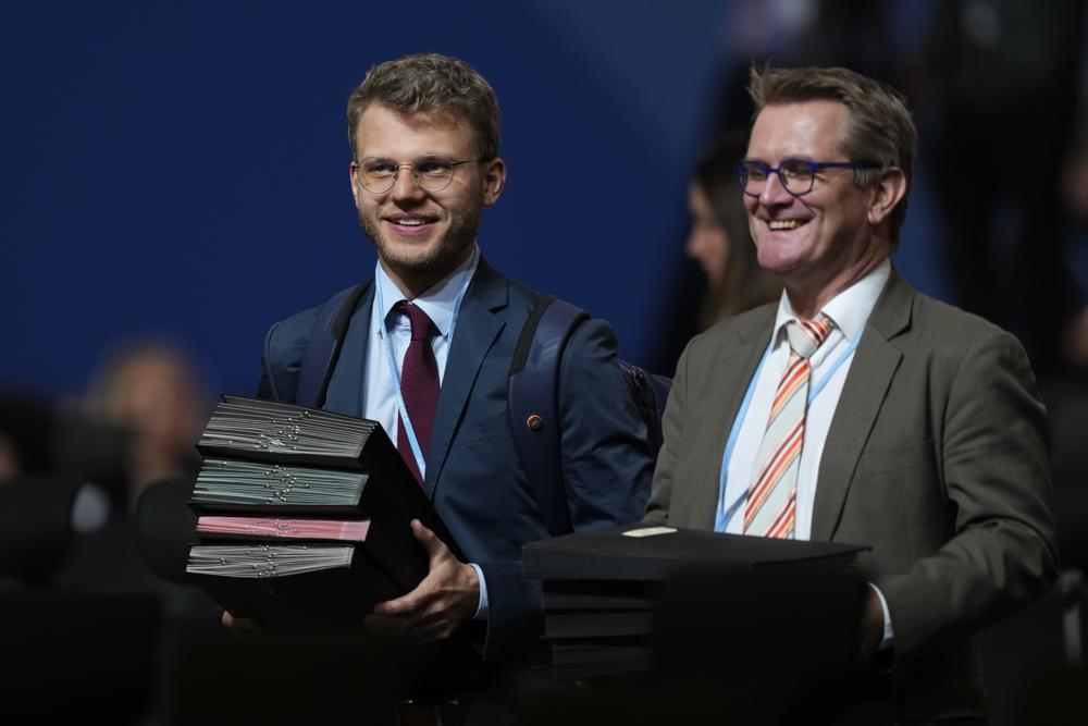 Documents are brought in for a closing plenary session at the COP27 U.N. Climate Summit, Sunday, Nov. 20, 2022, in Sharm el-Sheikh, Egypt. AP/RSS Photo