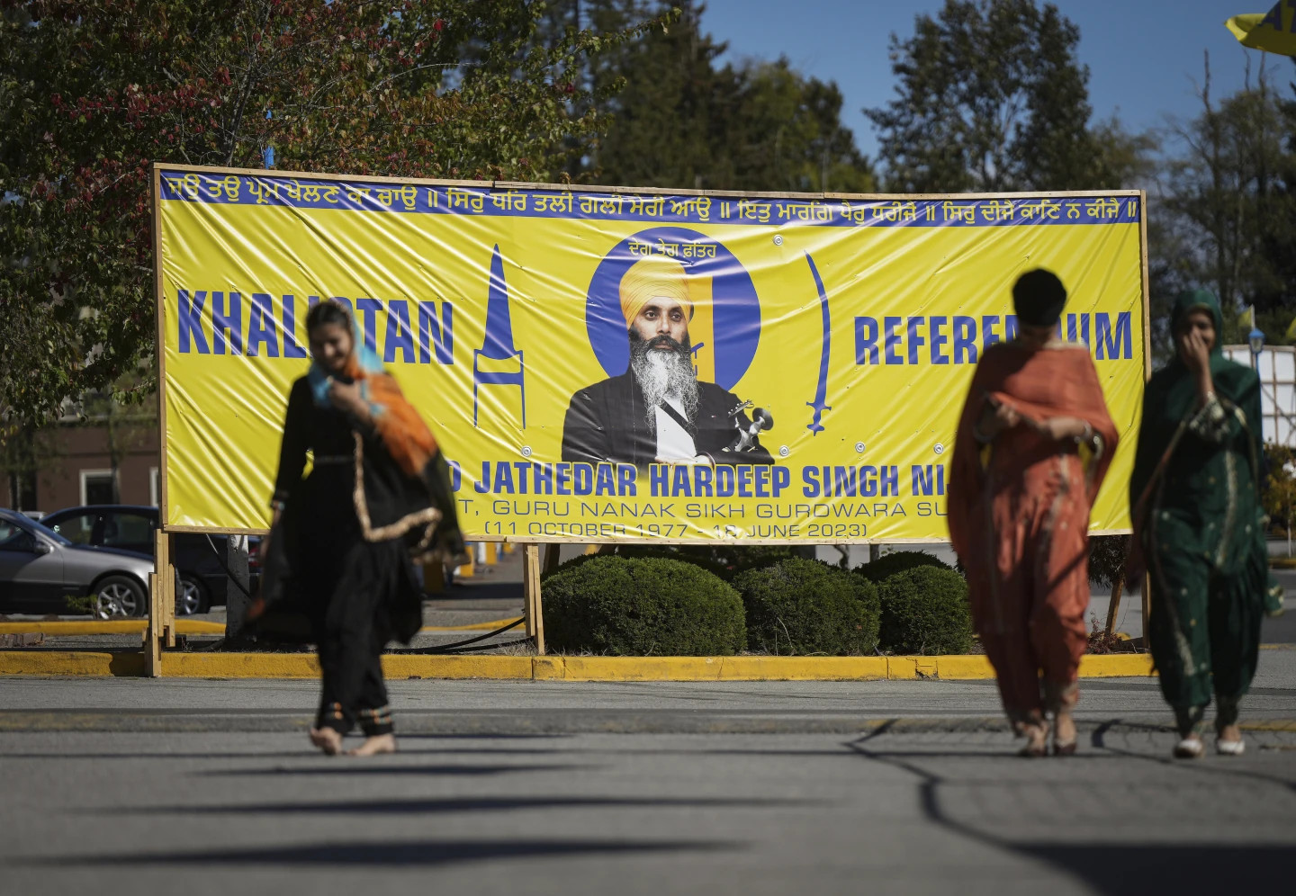 FILE - A photograph of late temple president Hardeep Singh Nijjar is seen on a banner outside the Guru Nanak Sikh Gurdwara Sahib in Surrey, British Columbia, on Sept. 18, 2023, where temple president Hardeep Singh Nijjar was gunned down in his vehicle while leaving the temple parking lot in June. (AP/RSS Photo)