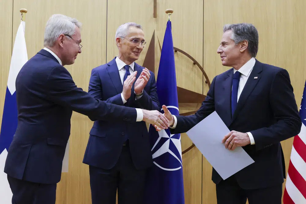 Finnish Foreign Minister Pekka Haavisto, left, shakes hands with United States Secretary of State Antony Blinken, right, after handing over his nation's accession document during a meeting of NATO foreign ministers at NATO headquarters in Brussels, Tuesday, April 4, 2023. (AP/RSS Photo)