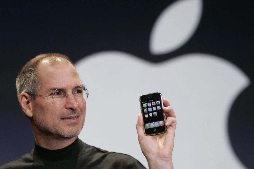 Apple CEO Steve Jobs holds up an Apple iPhone at the MacWorld Conference, Jan. 9, 2007, in San Francisco. On Sunday, July 16, 2023, a first-generation iPhone sold at auction for $190,373, almost 380 times its original price of $499 when the groundbreaking device went for sale in 2007. AP/RSS Photo