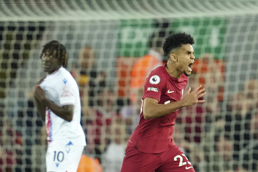 Liverpool's Luis Diaz, right, celebrates after scoring his side's opening goal during the English Premier League soccer match between Liverpool and Crystal Palace at Anfield stadium in Liverpool, England, Monday, Aug 15, 2022. (AP/RSS Photo)