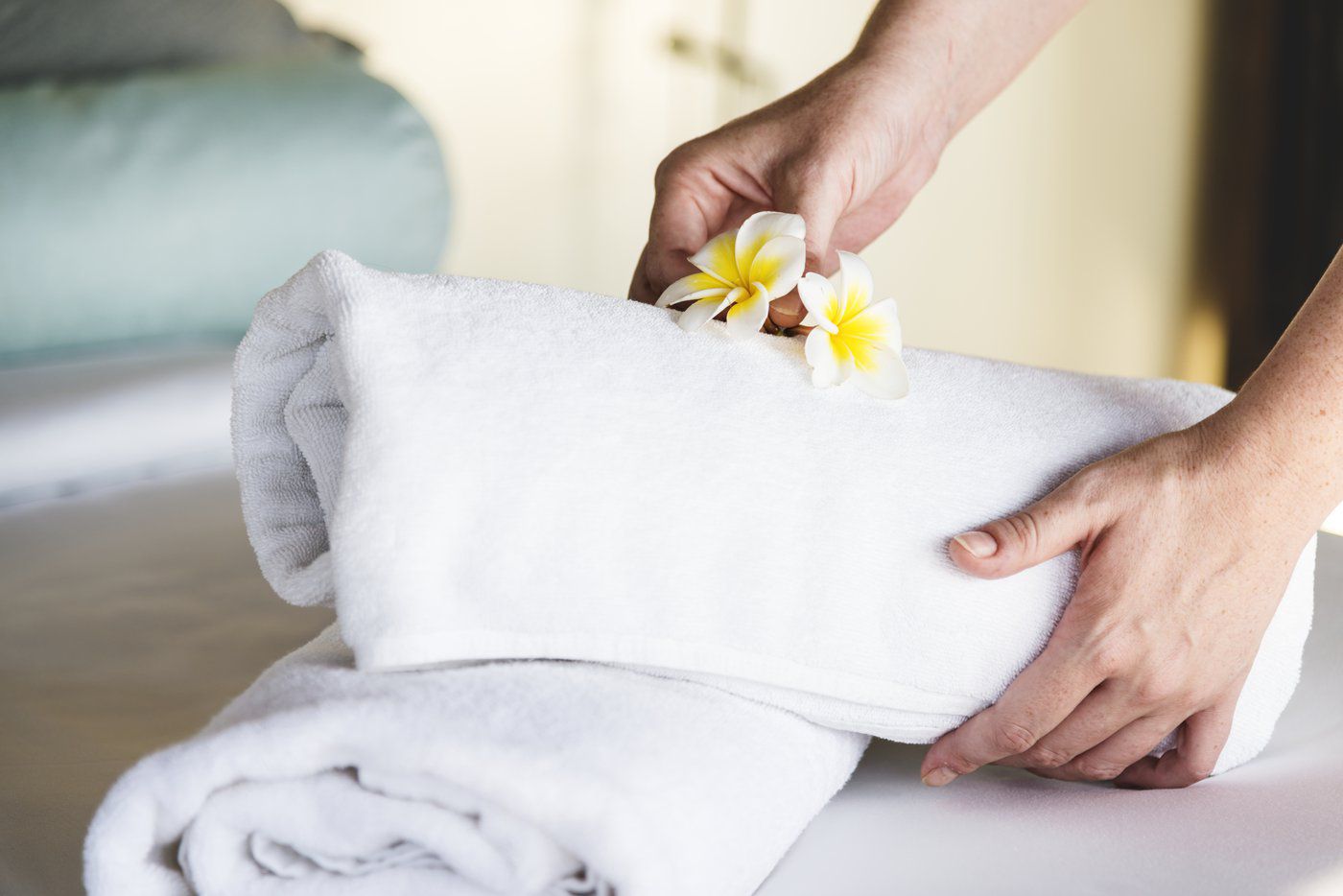 There are several 'nudges' hotels use to conserve energy and water such as encouraging guests to reuse hotel towels. (rawpixel.com)