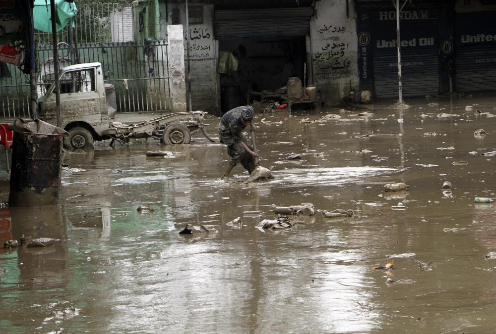 A Pakistani man looks for belongings from his flood-hit shop in Mingora, the capital of Swat valley in Pakistan, Saturday, Aug. 27, 2022.  AP/RSS Photo