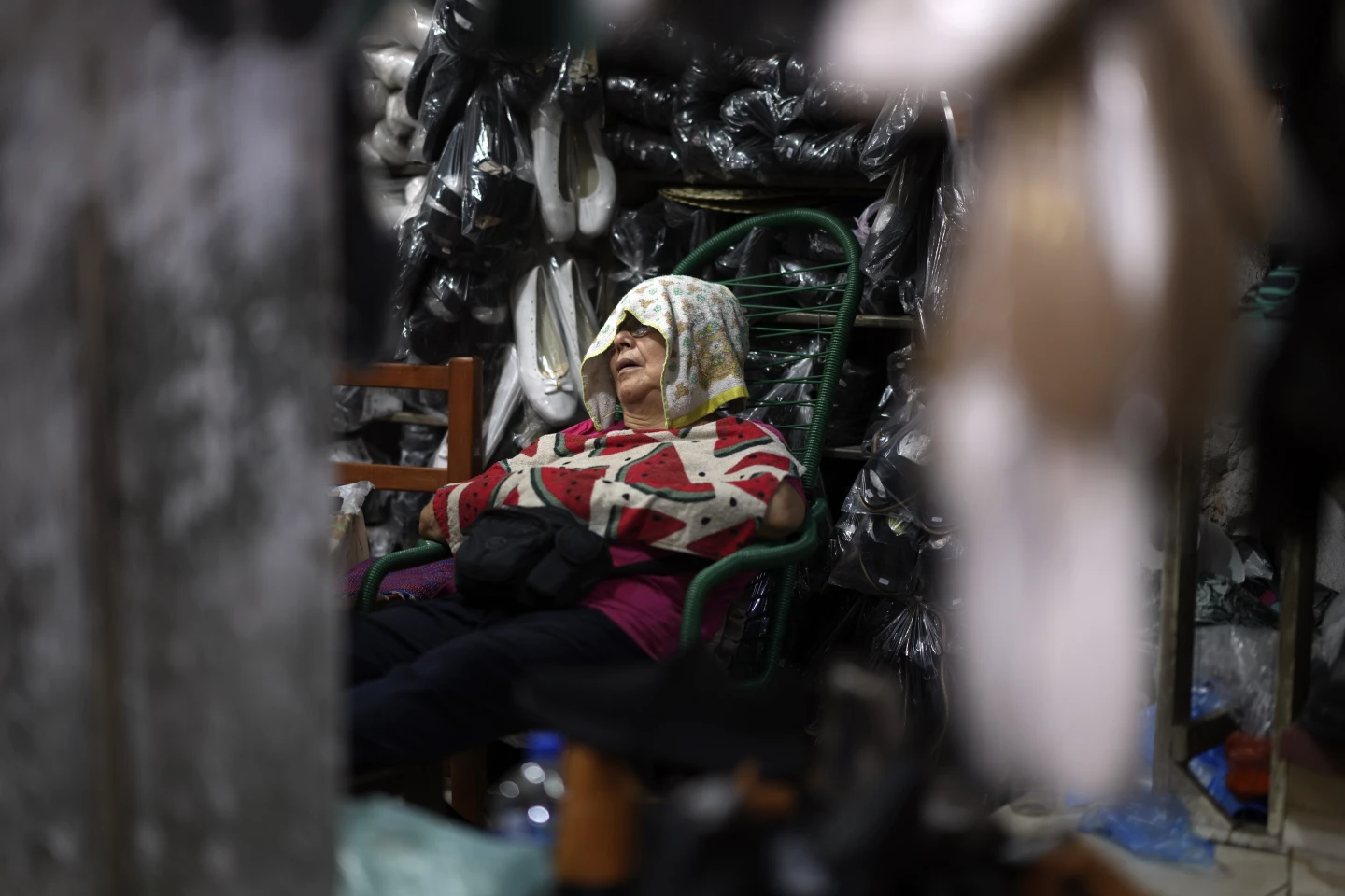 A vendor sleeps on a hot afternoon at her shop at Market 4 in Asuncion, Paraguay, Jan. 17, 2025. AP/ RSS Photo