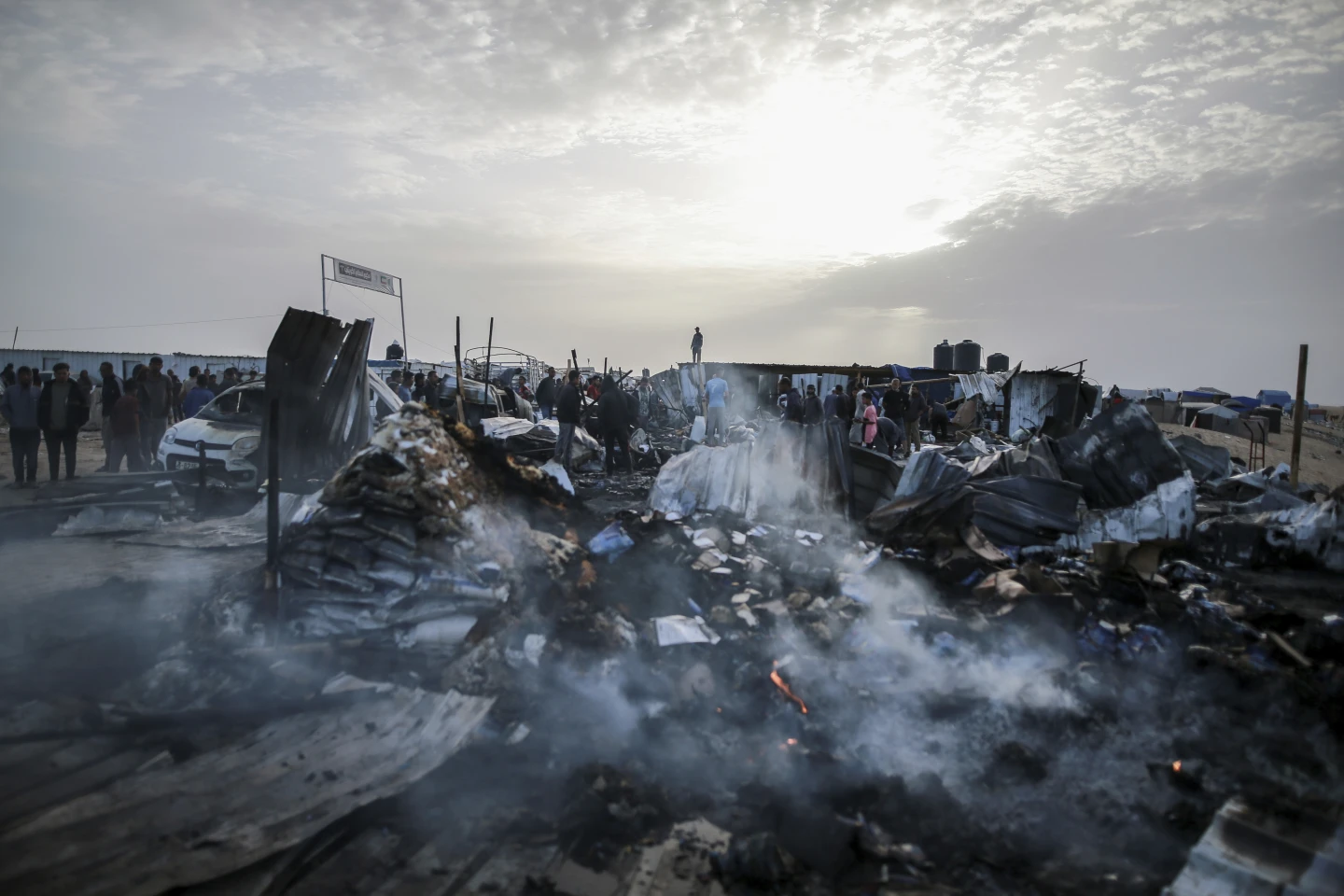 Palestinians look at the destruction after an Israeli strike where displaced people were staying in Rafah, Gaza Strip, Monday, May 27, 2024. AP/RSS Photo