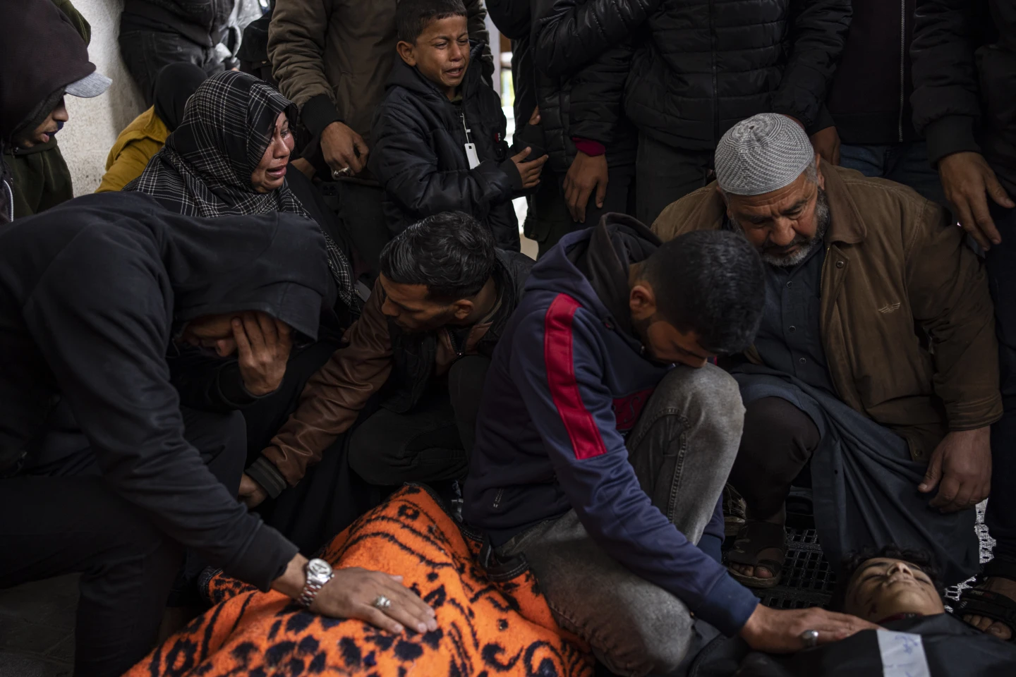 Palestinians mourning at a morgue in Rafah. AP/RSS Photo