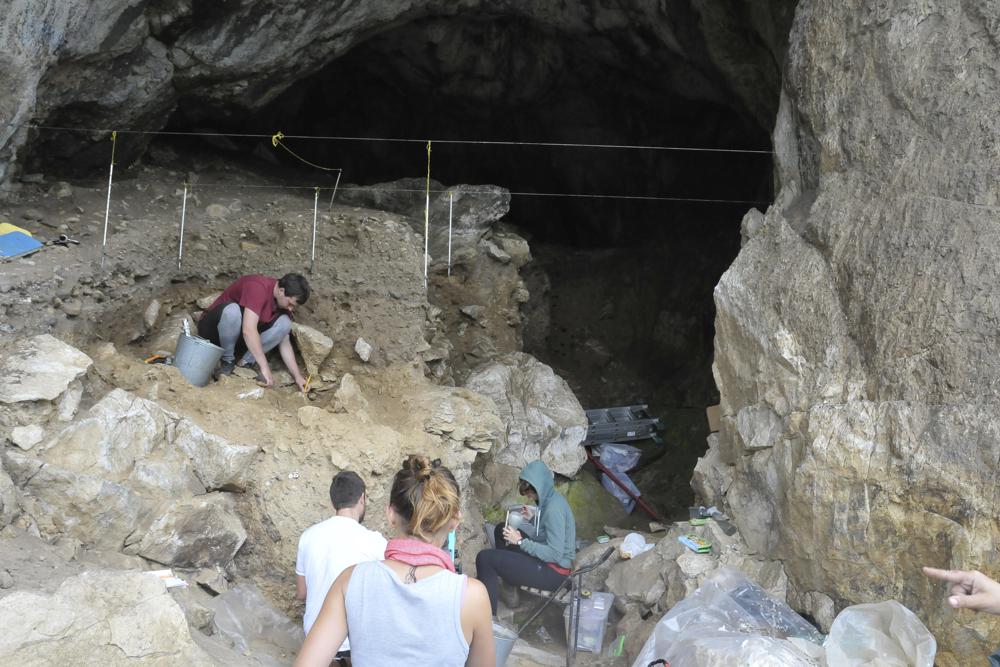 In this photo provided by Bence Viola in October 2022, researchers excavate a cave in the mountains of Siberia, Russia. AP/RSS Photo